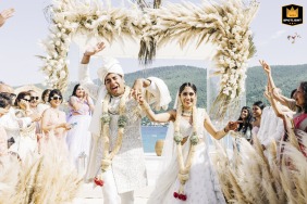 Newlyweds happily exiting their outdoor ceremony at San Vito Al Tagliamento, Pordenone in Friuli Venezia Giulia, Italy.